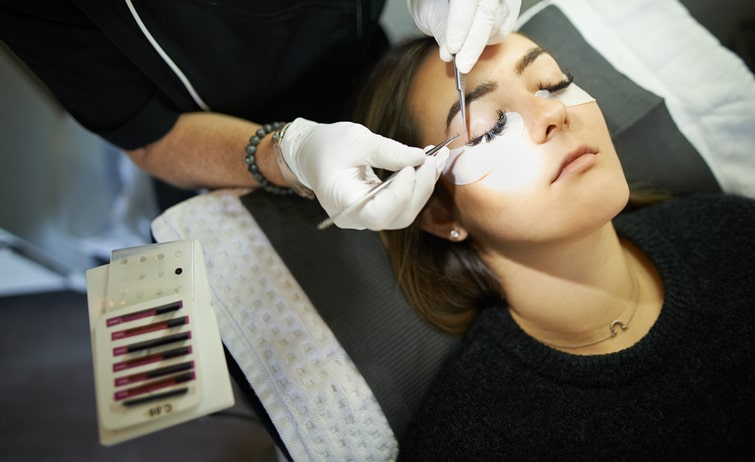 Woman Getting Eyelash Extensions Applied