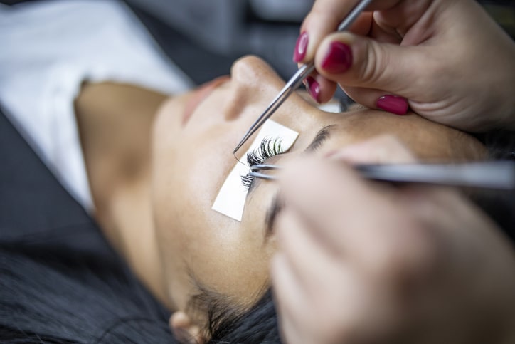 Applying eyelash extensions