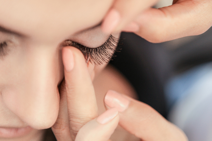 Applying fake eyelashes