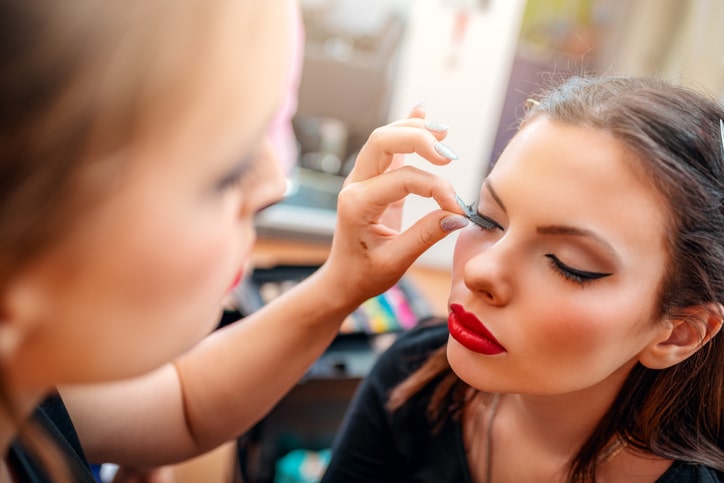 Woman Applying Fake Eyelashes