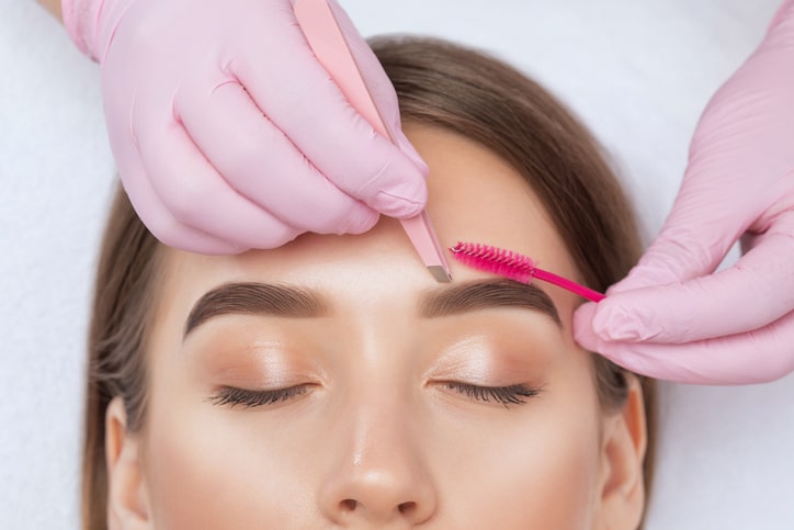 Woman getting eyebrows tinted