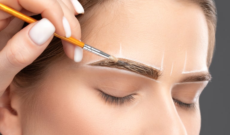 Woman Getting Eyebrows Waxed