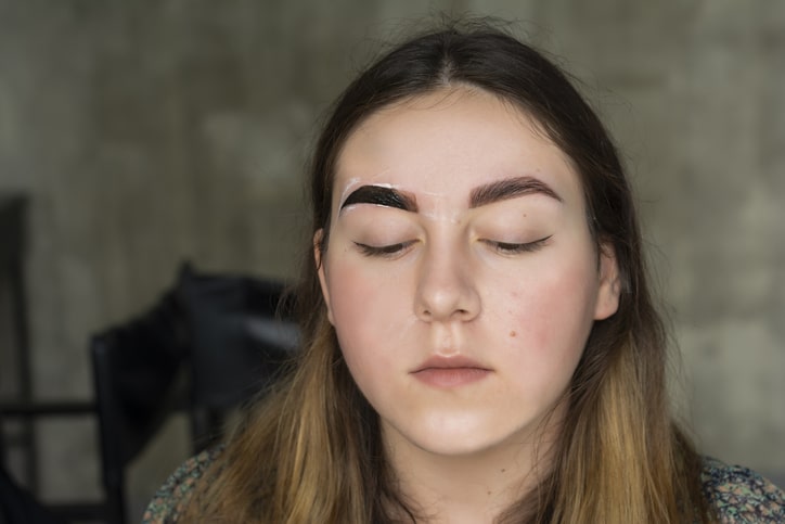 Woman getting eyebrows tinted