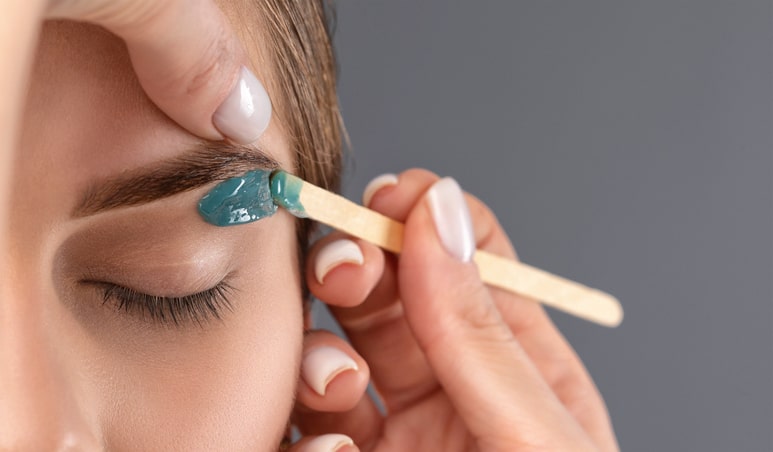 Woman Getting Eyebrows Waxed