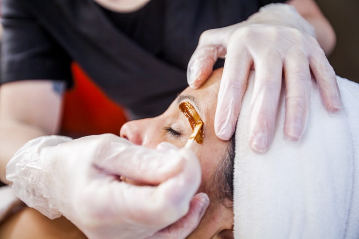 Woman Getting Eyebrows Waxed