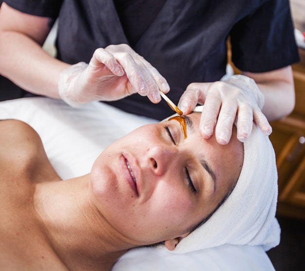 Woman Getting Eyebrows Waxed