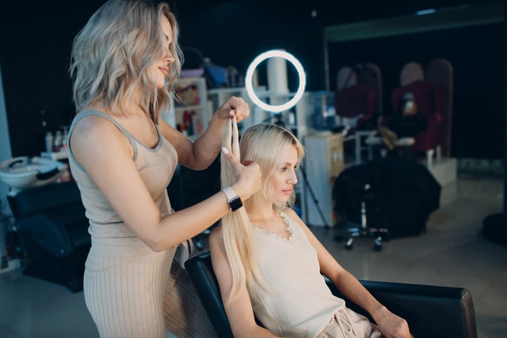 Woman Getting Hair Styled at salon