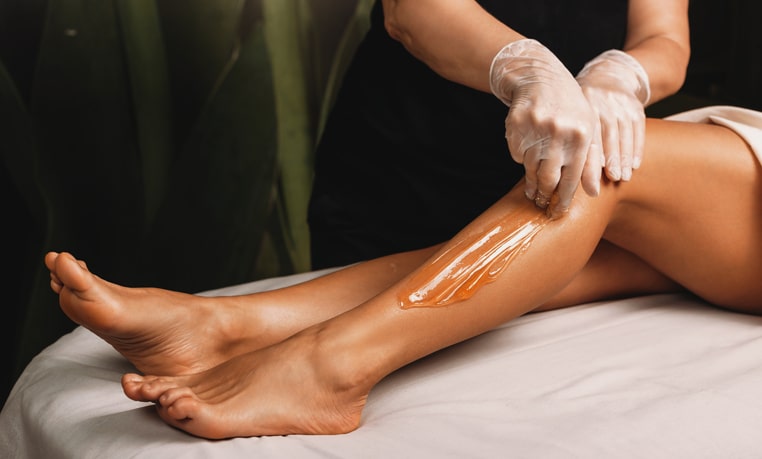 Woman Getting Legs Waxed