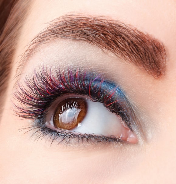 Woman wearing colored eyelash extensions by Lash Stuff