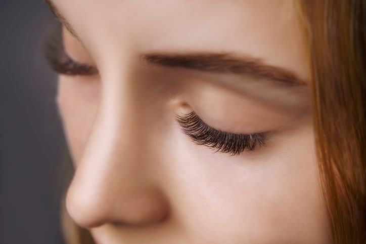 Woman wearing magnetic eyelashes