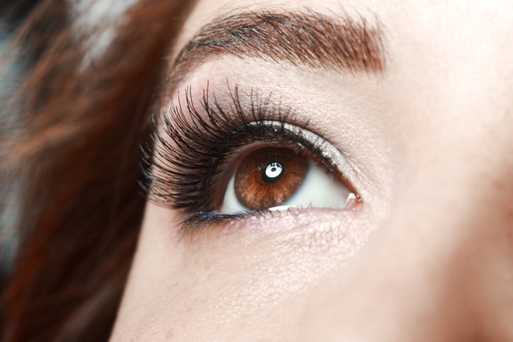 Woman wears the best eyelash extensions