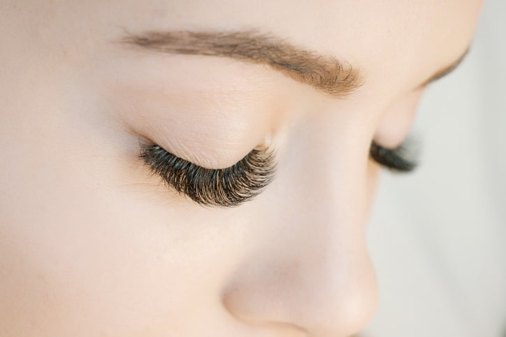woman with finished eyelash extensions